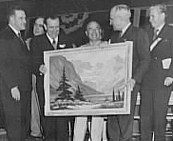 Leonard Lopp presents a painting to Harry S. Truman at the dedication of Hungry Horse Dam